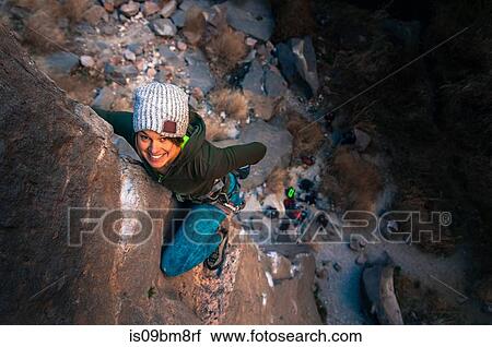 Stock Image - Woman rock climbing, Owens River Gorge, Bishop, California, USA. Fotosearch