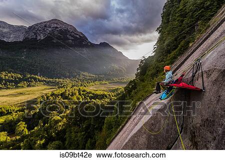 Woman sitting on portaledge, Cochamo, Los Lagos, Chile View Large Photo Image Stock Image - Woman sitting on portaledge, Cochamo, Los Lagos, Chile. Fotosearch