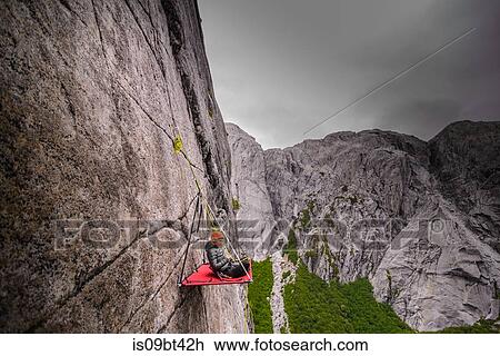 Woman sitting on portaledge, Cochamo, Los Lagos, Chile View Large Photo Image Stock Image - Woman sitting on portaledge, Cochamo, Los Lagos, Chile. Fotosearch