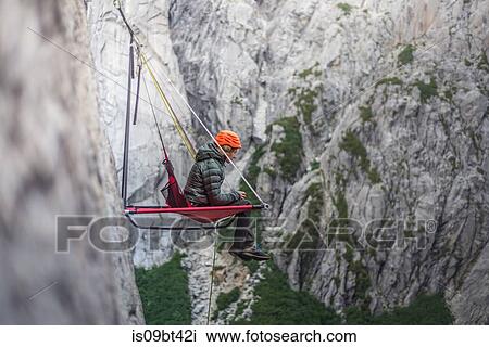 Woman sitting on portaledge, Cochamo, Los Lagos, Chile View Large Photo Image Stock Image - Woman sitting on portaledge, Cochamo, Los Lagos, Chile. Fotosearch