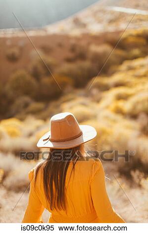 Woman walking in field landscape, Kennedy Meadows, California, US View Large Photo Image Stock Photography - Woman walking in field landscape, Kennedy Meadows, California, US. Fotosearch