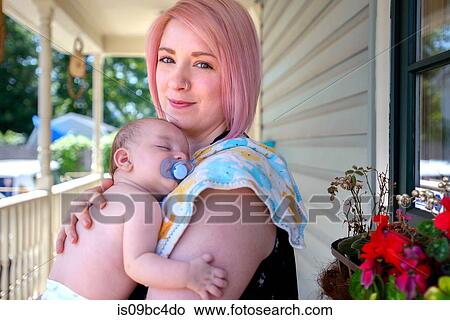 Picture - Woman with baby boy in arms. Fotosearch