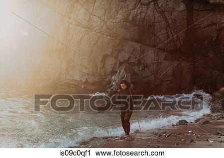 Woman with flippers and spear on beach, Big Sur, California, United States View Large Photo Image Stock Image - Woman with flippers and spear on beach, Big Sur, California, United States. Fotosearch