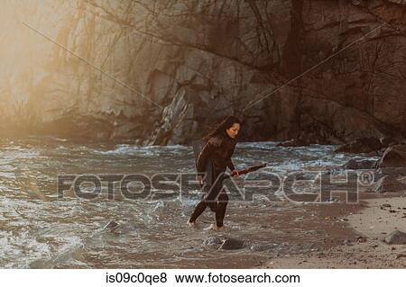Woman with flippers and speargun on beach, Big Sur, California, United States View Large Photo Image Stock Photo - Woman with flippers and speargun on beach, Big Sur, California, United States. Fotosearch