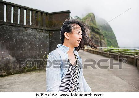 Woman with windswept hair, Nuuanu Pali Lookout, Oahu, Hawaii View Large Photo Image Stock Photo - Woman with windswept hair, Nuuanu Pali Lookout, Oahu, Hawaii. Fotosearch