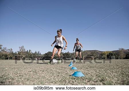 Women dribbling footballs View Large Photo Image Picture - Women dribbling footballs. Fotosearch