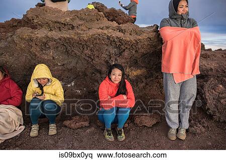 Women hugging themselves to warm up, Haleakala National Park, Maui, Hawaii View Large Photo Image Stock Photography - Women hugging themselves to warm up, Haleakala National Park, Maui, Hawaii. Fotosearch