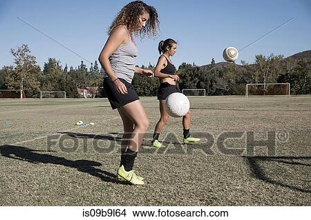 Women of football pitch playing football View Large Photo Image Picture - Women of football pitch playing football. Fotosearch