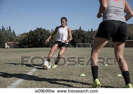 Women on football pitch playing football View Large Photo Image Stock Photo - Women on football pitch playing football. Fotosearch