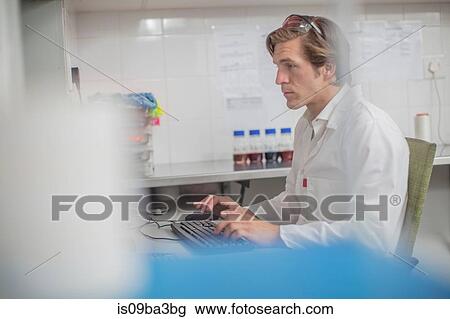 Worker in thread factory, sitting at desk, using computer View Large Photo Image Stock Image - Worker in thread factory, sitting at desk, using computer. Fotosearch