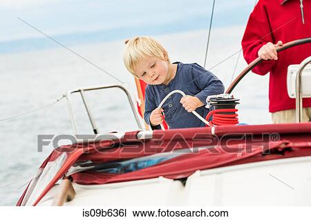 Young boy on sailing boat with great grandfather, mid section, Geneva, Switzerland, Europe View Large Photo Image Stock Image - Young boy on sailing boat with great grandfather, mid section, Geneva, Switzerland, Europe. Fotosearch