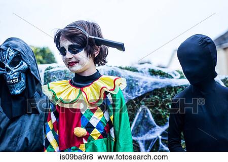 Stock Photo - Young boys dressed in halloween costume, outdoors. Fotosearch