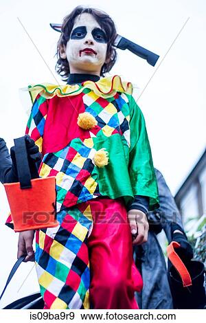 Stock Photo - Young boys dressed in halloween costume, outdoors, low angle view. Fotosearch