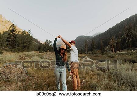 Young couple dancing together in rural valley, Mineral King, California, USA View Large Photo Image Stock Image - Young couple dancing together in rural valley, Mineral King, California, USA. Fotosearch