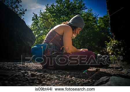 Young female rock climber 0eparing for climb, Smoke Bluffs, Squamish, British Columbia, Canada View Large Photo Image Stock Image - Young female rock climber 0eparing for climb, Smoke Bluffs, Squamish, British Columbia, Canada. Fotosearch