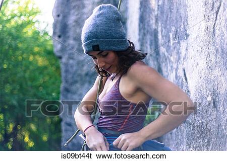 Young female rock climber 0eparing climbing ropes at rock face, Smoke Bluffs, Squamish, British Columbia, Canada View Large Photo Image Stock Photograph - Young female rock climber 0eparing climbing ropes at rock face, Smoke Bluffs, Squamish, British Columbia, Canada. Fotosearch