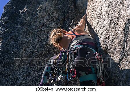 Young female rock climber climbing rock face, Smoke Bluffs, Squamish, British Columbia, Canada View Large Photo Image Picture - Young female rock climber climbing rock face, Smoke Bluffs, Squamish, British Columbia, Canada. Fotosearch