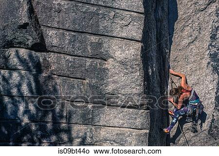 Young female rock climber climbing rock face, Smoke Bluffs, Squamish, British Columbia, Canada View Large Photo Image Picture - Young female rock climber climbing rock face, Smoke Bluffs, Squamish, British Columbia, Canada. Fotosearch