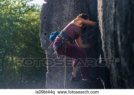 Young female rock climber climbing rock face, full length, side view, Smoke Bluffs, Squamish, British Columbia, Canada View Large Photo Image Stock Photography - Young female rock climber climbing rock face, full length, side view, Smoke Bluffs, Squamish, British Columbia, Canada. Fotosearch