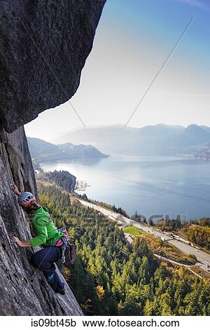 Young female rock climber climbing up rock face, elevated view, The Chief, Squamish, British Columbia, Canada View Large Photo Image Stock Image - Young female rock climber climbing up rock face, elevated view, The Chief, Squamish, British Columbia, Canada. Fotosearch