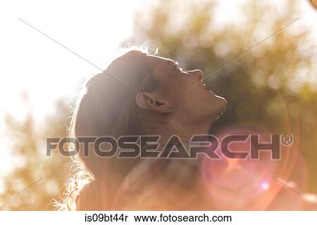 Young female rock climber looking up, backlit, Smoke Bluffs, Squamish, British Columbia, Canada View Large Photo Image Stock Photography - Young female rock climber looking up, backlit, Smoke Bluffs, Squamish, British Columbia, Canada. Fotosearch