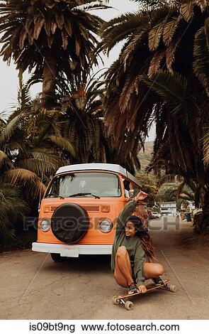 Young female skateboarder crouch skateboarding near beach, Jalama, California, USA View Large Photo Image Stock Image - Young female skateboarder crouch skateboarding near beach, Jalama, California, USA. Fotosearch