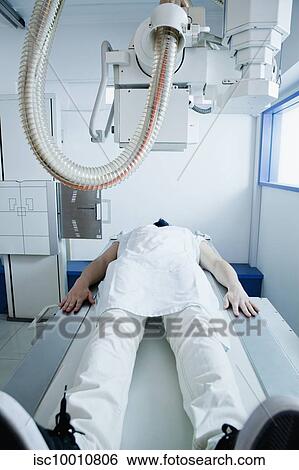 Young male patient having a CT scan in radiology department, front view View Large Photo Image Stock Photograph - Young male patient having a CT scan in radiology department, front view. Fotosearch