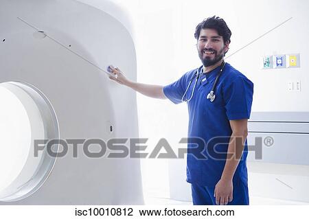 Young male radiographer operating CT scanner in radiology department, portrait View Large Photo Image Stock Image - Young male radiographer operating CT scanner in radiology department, portrait. Fotosearch