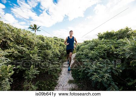 Young man exercising, running outdoors, South Point Park, Miami Beach, Florida, USA View Large Photo Image Stock Photo - Young man exercising, running outdoors, South Point Park, Miami Beach, Florida, USA. Fotosearch