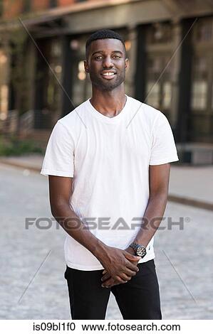 Young man in streets of New York, US View Large Photo Image Stock Image - Young man in streets of New York, US. Fotosearch