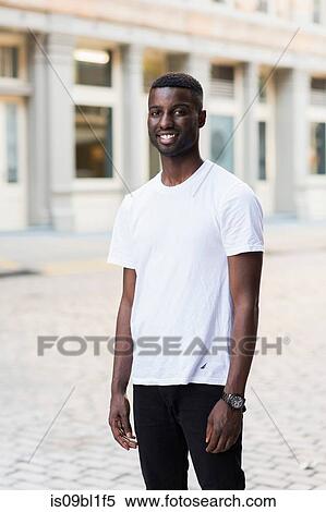 Stock Photography - Young man in streets of New York, US. Fotosearch