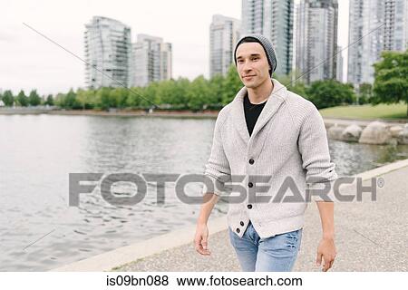 Young man walking along seawall, Yaletown, Vancouver, Canada View Large Photo Image Stock Photo - Young man walking along seawall, Yaletown, Vancouver, Canada. Fotosearch