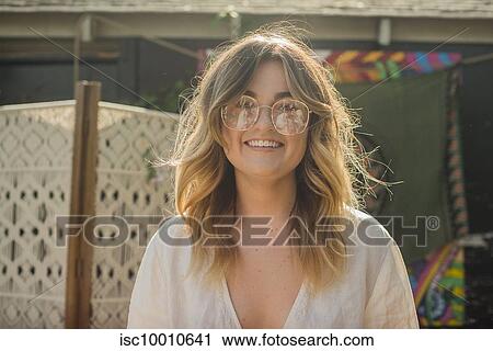 Young woman at community garden party, head and shoulder portrait View Large Photo Image Stock Image - Young woman at community garden party, head and shoulder portrait. Fotosearch