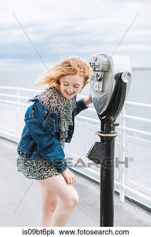 Young woman by coin operated binoculars on pier, Menemsha, Martha's Vineyard, Massachusetts, USA View Large Photo Image Stock Image - Young woman by coin operated binoculars on pier, Menemsha, Martha's Vineyard, Massachusetts, USA. Fotosearch