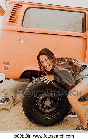 Young woman changing recreational vehicle tyre at beach, portrait, Jalama, California, USA View Large Photo Image Stock Photography - Young woman changing recreational vehicle tyre at beach, portrait, Jalama, California, USA. Fotosearch
