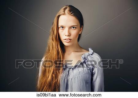 Young woman, grey background View Large Photo Image Stock Image - Young woman, grey background. Fotosearch