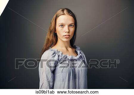 Young woman, grey background View Large Photo Image Stock Image - Young woman, grey background. Fotosearch
