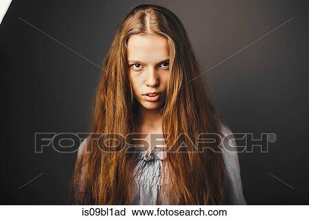 Young woman, grey background View Large Photo Image Stock Image - Young woman, grey background. Fotosearch
