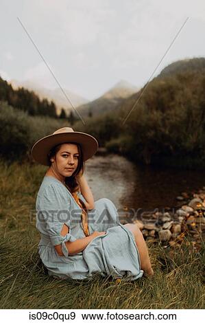 Young woman in stetson sitting by rural river, portrait, Mineral King, California, USA View Large Photo Image Stock Photo - Young woman in stetson sitting by rural river, portrait, Mineral King, California, USA. Fotosearch