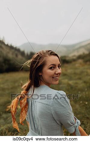 Picture - Young woman looking back in rural valley, portrait, Mineral King, California, USA. Fotosearch