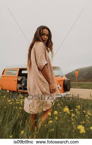 Young woman looking back in yellow wildflower field, portrait, Jalama, California, USA View Large Photo Image Stock Image - Young woman looking back in yellow wildflower field, portrait, Jalama, California, USA. Fotosearch