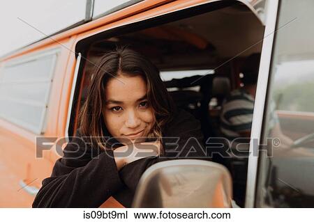 Young woman looking out from recreational vehicle window, portrait, Jalama, California, USA View Large Photo Image Stock Image - Young woman looking out from recreational vehicle window, portrait, Jalama, California, USA. Fotosearch