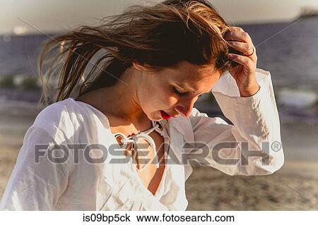 Young woman on beach View Large Photo Image Stock Image - Young woman on beach. Fotosearch