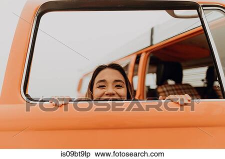 Young woman peeking through recreational vehicle window at beach, portrait, Jalama, California, USA View Large Photo Image Stock Photography - Young woman peeking through recreational vehicle window at beach, portrait, Jalama, California, USA. Fotosearch