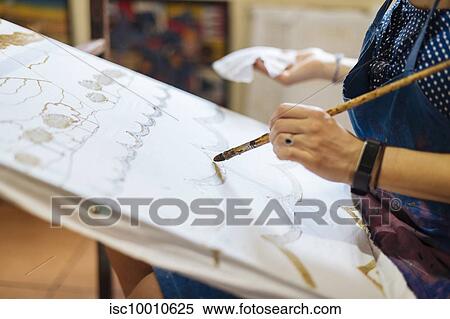 Young woman practicing Batik in art classroom, a traditional form of Indonesian painting, cropped view of hands View Large Photo Image Stock Photography - Young woman practicing Batik in art classroom, a traditional form of Indonesian painting, cropped view of hands. Fotosearch