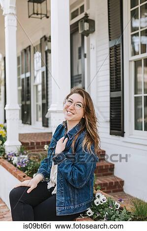 Young woman sitting on village wall, portrait, Menemsha, Martha's Vineyard, Massachusetts, USA View Large Photo Image Stock Image - Young woman sitting on village wall, portrait, Menemsha, Martha's Vineyard, Massachusetts, USA. Fotosearch