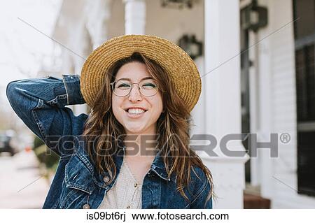Young woman strolling on sidewalk wearing straw boater, portrait, Menemsha, Martha's Vineyard, Massachusetts, USA View Large Photo Image Stock Image - Young woman strolling on sidewalk wearing straw boater, portrait, Menemsha, Martha's Vineyard, Massachusetts, USA. Fotosearch