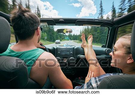 Young woman with feet up driving on road trip with boyfriend, Breckenridge, Colorado, USA View Large Photo Image Stock Image - Young woman with feet up driving on road trip with boyfriend, Breckenridge, Colorado, USA. Fotosearch