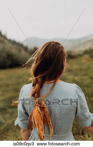 Young woman with plaited hair looking out at rural valley, rear view, Mineral King, California, USA View Large Photo Image Stock Image - Young woman with plaited hair looking out at rural valley, rear view, Mineral King, California, USA. Fotosearch