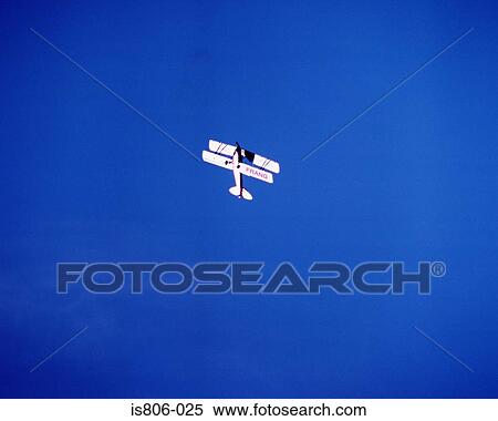 Stock Photography - Biplane manoeuvring. Fotosearch